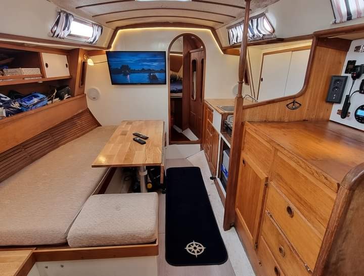 Interior salon cabin with table and cushions